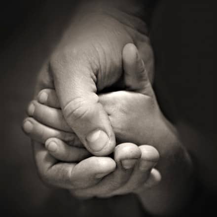 man-hold-child-hand